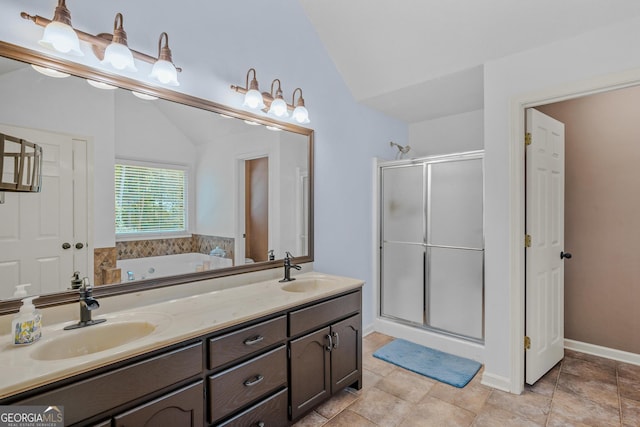 bathroom featuring lofted ceiling, vanity, and shower with separate bathtub