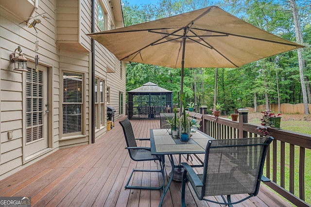 wooden terrace featuring a gazebo