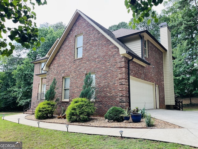 view of side of home featuring a garage