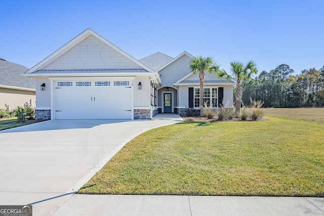 view of front facade featuring driveway, stone siding, a garage, and a front lawn