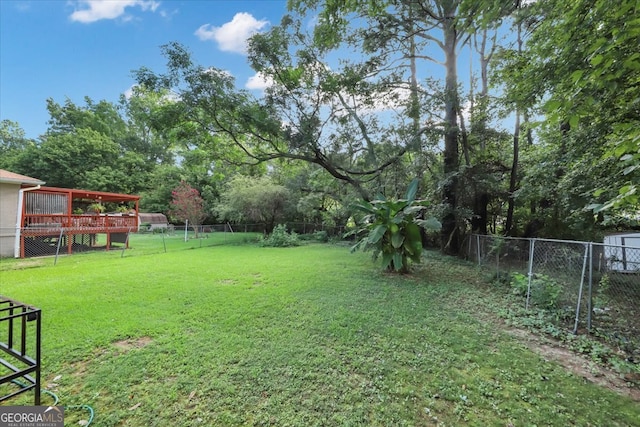 view of yard featuring a wooden deck