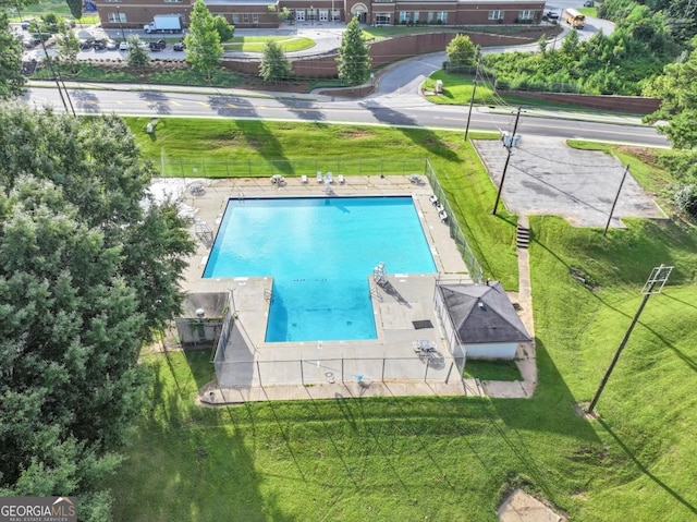 view of pool with a yard and a patio