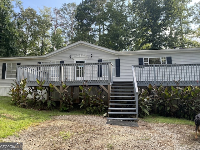 back of property with a deck