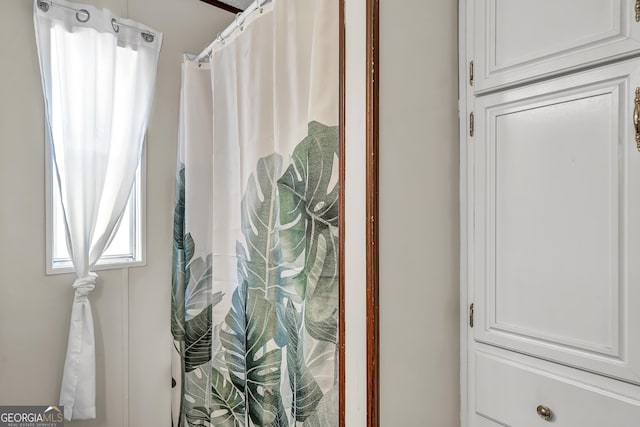 bathroom with a shower with shower curtain