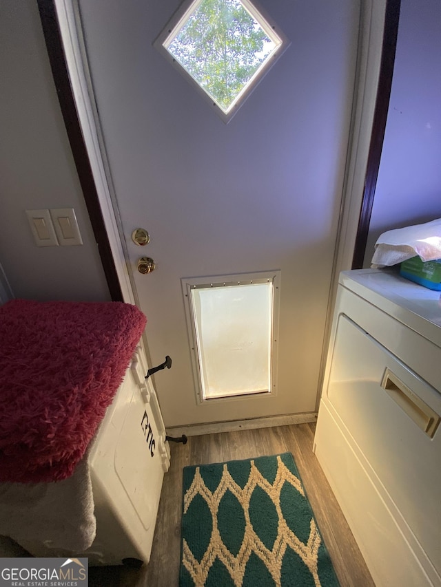 interior space featuring light hardwood / wood-style flooring and washer / dryer