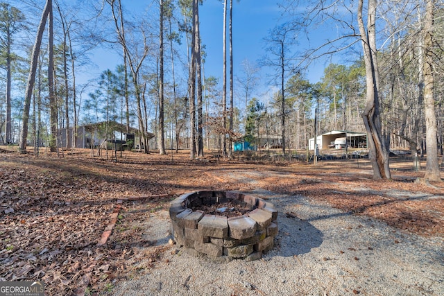 view of yard featuring a fire pit