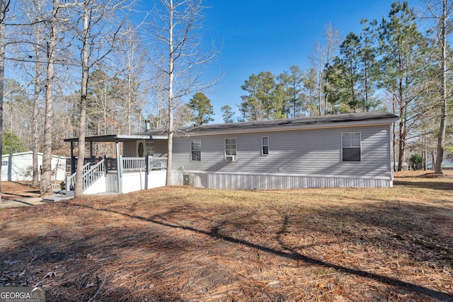 rear view of house with a porch