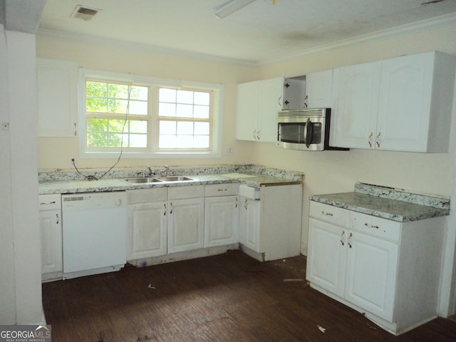 kitchen with a sink, visible vents, white cabinets, dishwasher, and stainless steel microwave