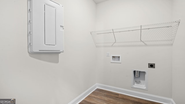 laundry room with dark hardwood / wood-style flooring, hookup for a washing machine, and hookup for an electric dryer