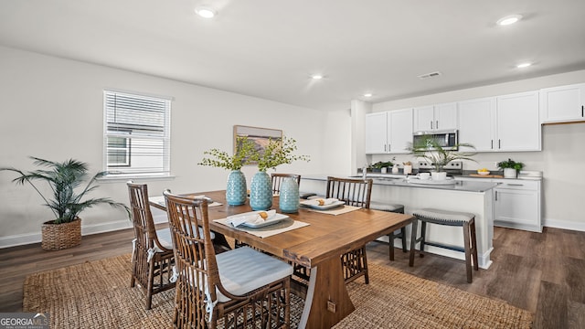 dining room featuring dark hardwood / wood-style flooring