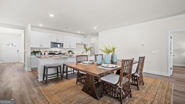 dining room featuring dark wood-type flooring