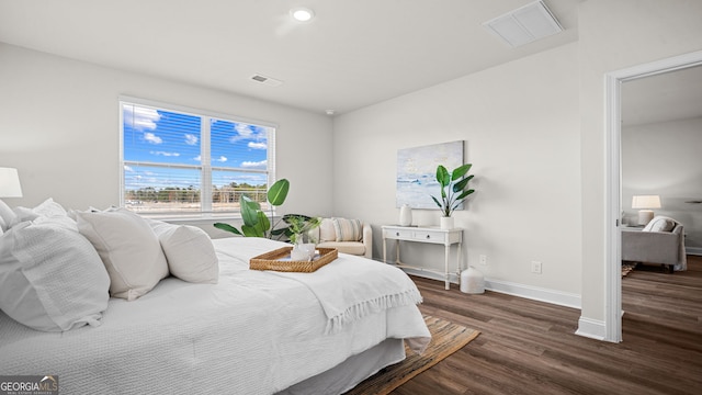 bedroom featuring dark hardwood / wood-style flooring