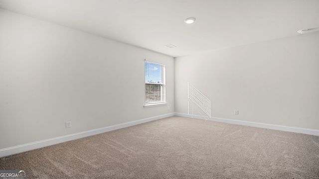 spare room with carpet flooring