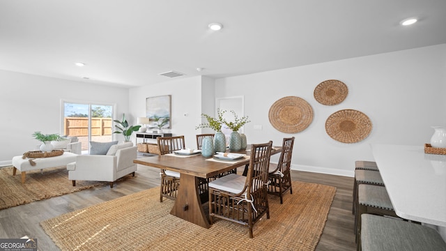 dining room featuring recessed lighting, visible vents, baseboards, and wood finished floors