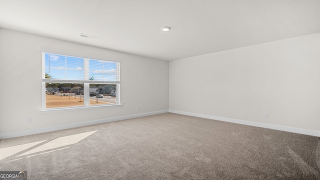 unfurnished room with carpet