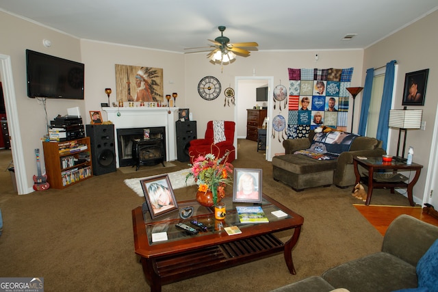 living room featuring carpet floors, ceiling fan, and crown molding