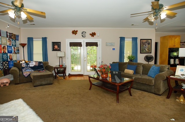 carpeted living room with french doors, ceiling fan, and ornamental molding