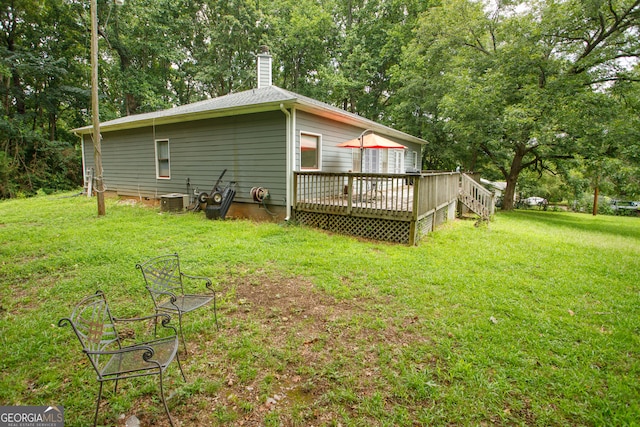 exterior space featuring a deck and central AC