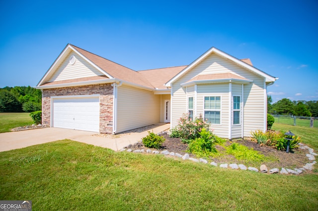 ranch-style home with a front lawn and a garage