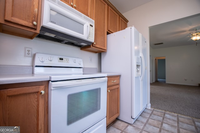 kitchen with ceiling fan, white appliances, and light tile patterned floors