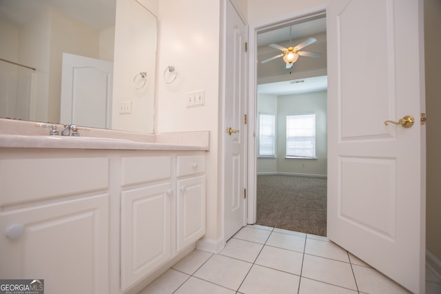 bathroom with ceiling fan, tile patterned floors, and vanity