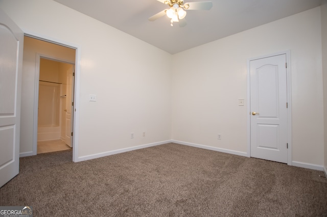 unfurnished room featuring ceiling fan and carpet floors