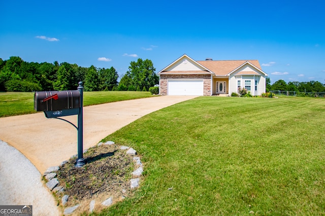 view of front of house with a front yard and a garage