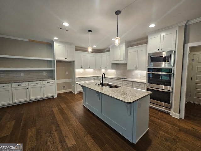 kitchen with light stone countertops, hanging light fixtures, dark hardwood / wood-style flooring, and white cabinetry