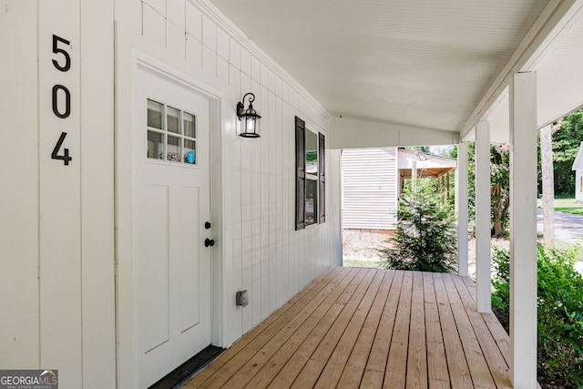 wooden terrace featuring a porch