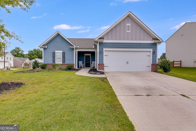 view of front of house with a garage and a front yard