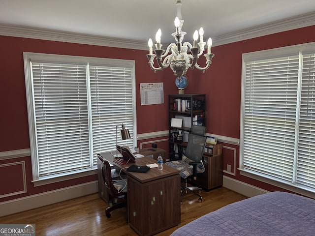 bedroom with ornamental molding, hardwood / wood-style floors, and a chandelier