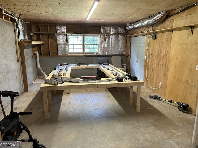 basement with a workshop area