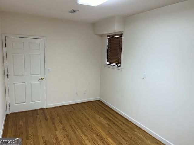 unfurnished room featuring wood-type flooring