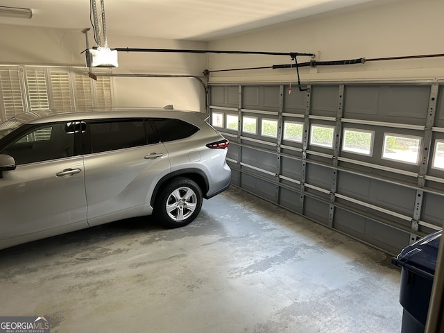 garage featuring a garage door opener