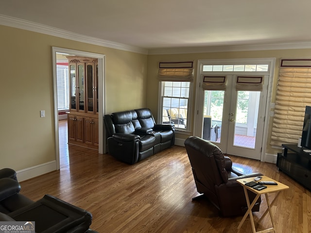 living room with ornamental molding, french doors, and hardwood / wood-style floors