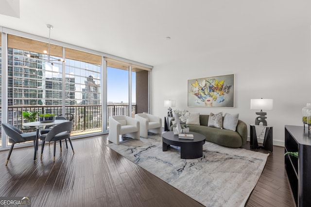 living room with dark hardwood / wood-style flooring and expansive windows