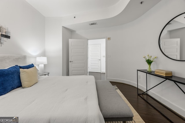 bedroom featuring dark wood-type flooring