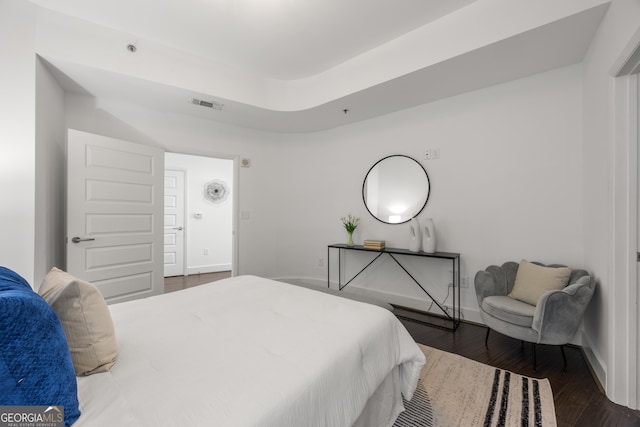 bedroom featuring dark hardwood / wood-style flooring