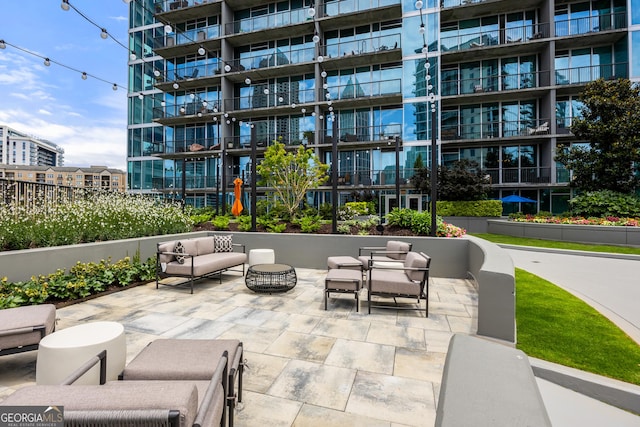 view of community with outdoor lounge area and a patio