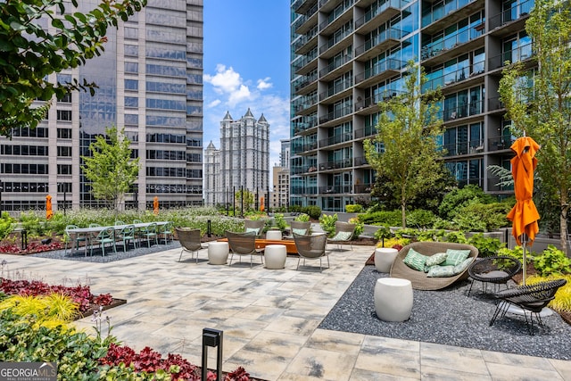 view of property's community featuring a patio area