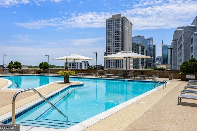 view of swimming pool featuring a patio