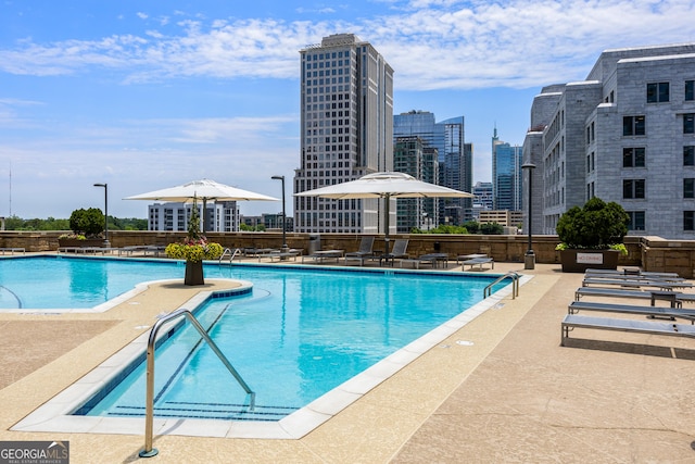 view of swimming pool with a patio