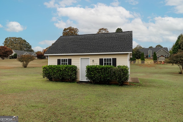 view of property exterior with a yard