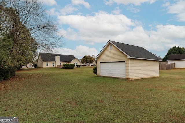 garage featuring a lawn