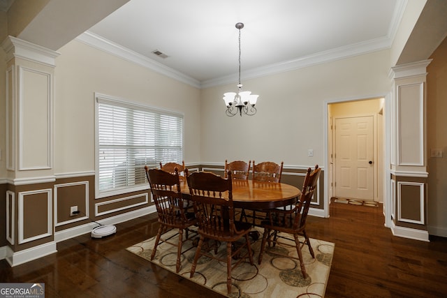 dining area with ornamental molding, decorative columns, and dark hardwood / wood-style floors