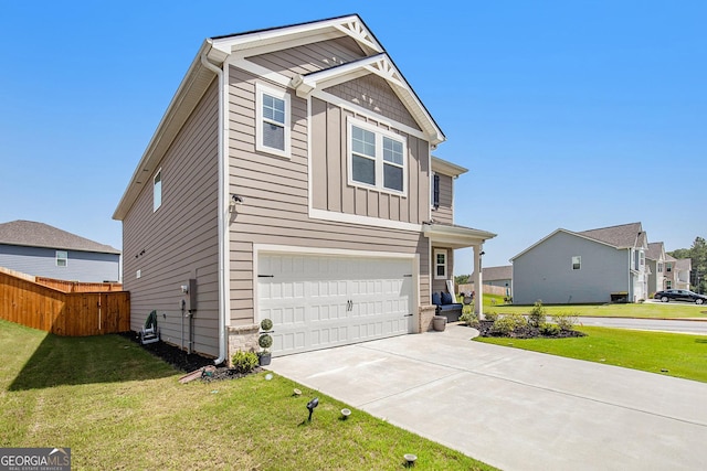 view of front of house featuring a garage and a front lawn