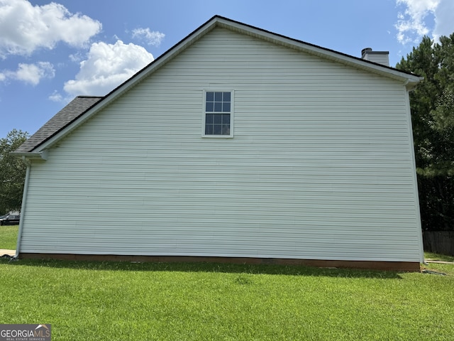 view of home's exterior featuring a lawn