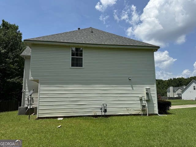 view of property exterior with a yard