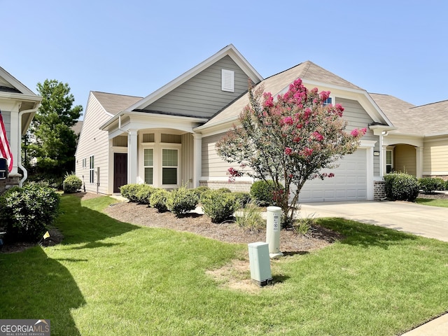 view of front facade featuring a garage and a front yard