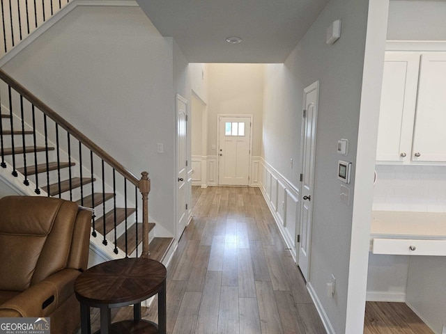 foyer with wood-type flooring